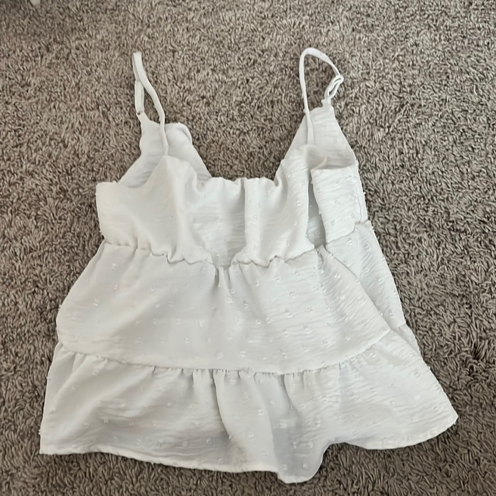 White polka dot flowy tank top. So cute on!